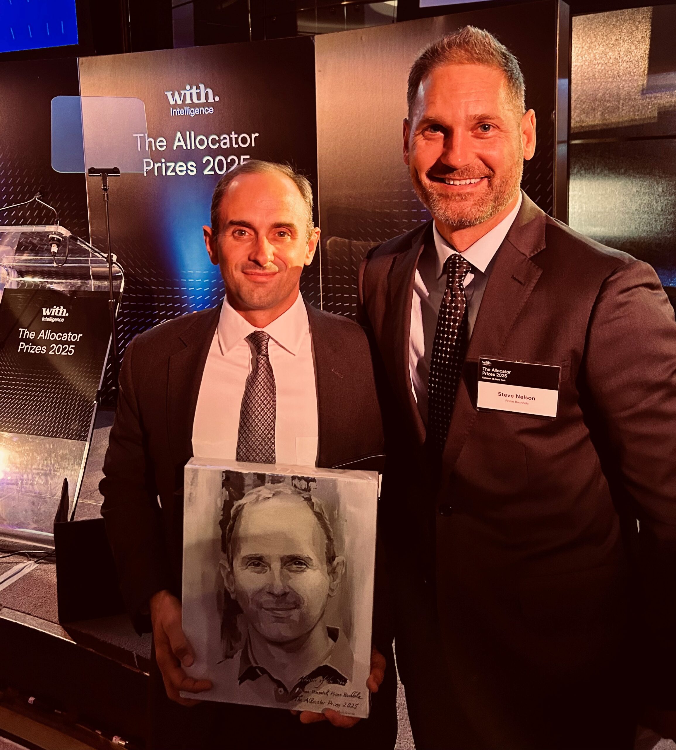 Prime Buchholz Principal and Consultant Brian Pimentel, left, wins Allocator of the Year Award. He is joined by Prime Buchholz Director of Consultant Steve Nelson, right, to celebrate the achievement.